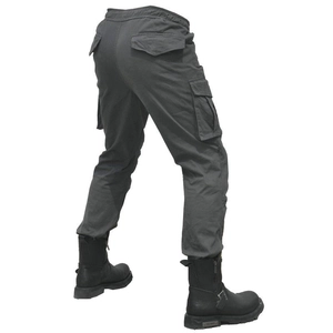 Detail of dark grey motorcycle cargo pants showing durable fabric and multi-pocket design