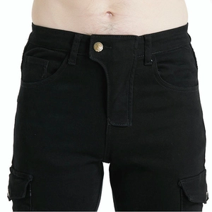 Detail view of military green motorcycle cargo pants with waist button and flap pockets