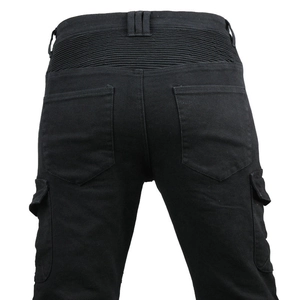 Detail of black motorcycle cargo pants showing elastic accordion panels and side pockets