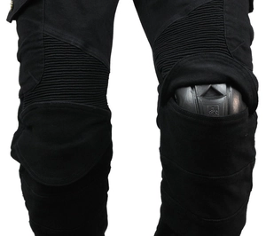 Detail of reinforced motorcycle pants showing protective knee pad and elastic stretch zones