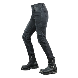 Detail of motorcycle riding jeans with accordion stretch panels and heavy motor boots