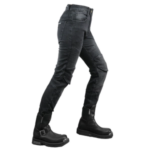 Detail of women's motorcycle jeans with accordion stretch panels and heavy motor boots