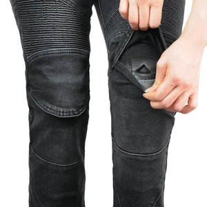 Close-up of knee accordion stretch panels and built-in protective armor on motorcycle jeans