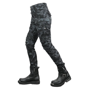 Detail of female camouflage motorcycle pants with reinforced knees and black leather boots