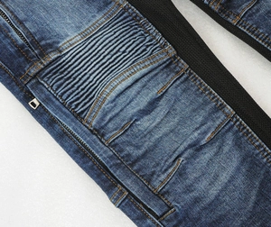 Close-up of motorcycle jeans with accordion stretch panels and side mesh ventilation