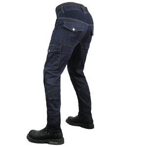 Detail of dark blue Cordura motorcycle pants showing side pockets and stretch panels