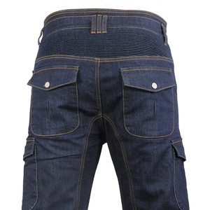 Detail of blue motorcycle riding jeans with stretch panels and snap button pockets