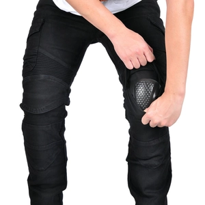 Detail of motorcycle pants featuring a removable knee protector and stretch panels