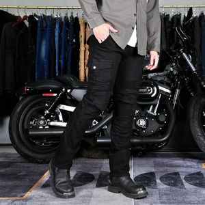 Close-up of black cargo motorcycle pants with knee stretch panels and side pockets
