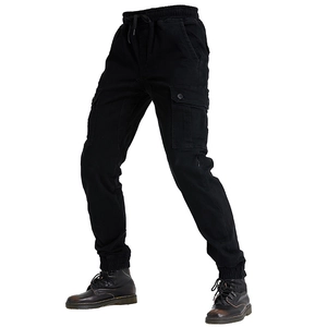 Detail of motorcycle cargo pants featuring elastic drawstring waist and large flap pockets