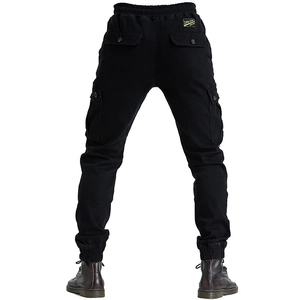 Rear view of black cargo riding pants featuring multiple pockets and elastic cuffs
