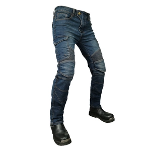 Close-up of motorcycle jeans featuring accordion stretch panels and denim texture