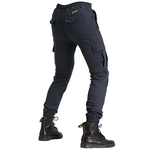 Detail view of motorcycle cargo pants featuring multi-pocket design and elastic cuffs