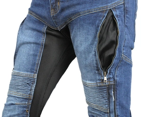 Detail of blue denim motorcycle pants featuring breathable black mesh and elastic knee panels
