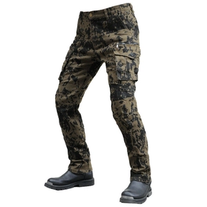 Detail of cargo motorcycle pants with black splatter camo pattern and side flap pockets