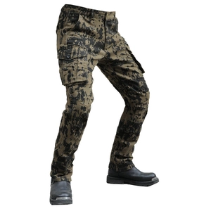 Detailed view of camouflage motorcycle cargo pants featuring side flap pockets and twill fabric