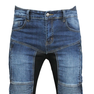 Close-up of denim motorcycle pants featuring breathable mesh and accordion stretch panels
