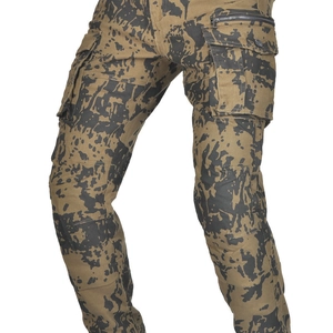 Detail of cargo motorcycle pants featuring khaki camouflage print and large utility pockets