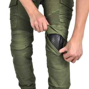 Detail of olive motorcycle pants featuring flexible accordion panels and knee protector inserts