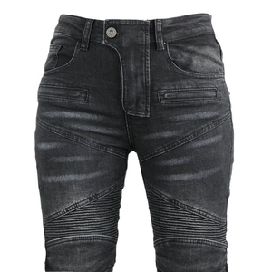 Detailed view of high-waist moto jeans with accordion stretch panels and washed black finish