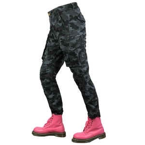 Detail view of motorcycle cargo pants with camo print and pink platform combat boots