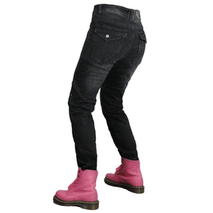 Detail of black motorcycle jeans featuring accordion stretch panels and flap pockets