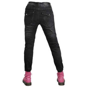 Detail of black motorcycle jeans featuring back pockets with button flaps and waist pleats