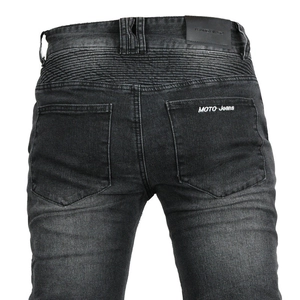Detailed view of accordion stretch panels and Moto Jeans embroidery on motorcycle pants