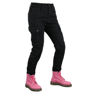 Detail of women's black cargo motorcycle pants with utility side pockets and pink boots