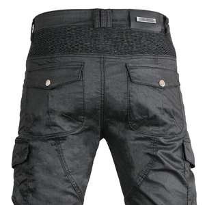 Detail of black motorcycle cargo pants showing stretch panels and buttoned back pockets