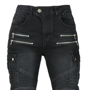 Detail of black motorcycle jeans with metallic zippers and ribbed protective knee panels
