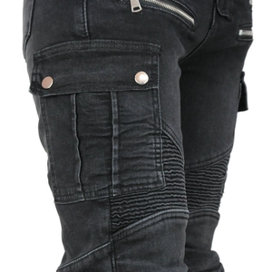 Detail of winter biker jeans featuring cargo pockets and pleated stretch panels