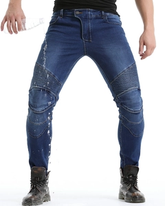 Close-up of waterproof motorcycle jeans showing water droplets on stretch denim fabric