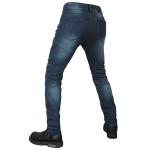 Macro detail of deep blue motorcycle jeans with ribbed stretch panels on the knees