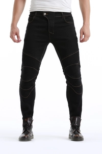 Close-up of motorcycle jeans with ribbed knee pleats and orange contrast stitching detail