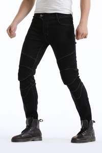 Detail of motorcycle jeans featuring stretch ribbed panels and reinforced knee stitching
