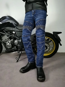 Detail view of motorcycle jeans featuring reinforced knee pads and elastic stretch panels