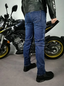 Detail of dark blue motorcycle jeans with accordion stretch panels for riding comfort