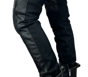 Detail view of motorcycle pants featuring breathable mesh panels and ankle zipper closure