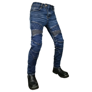 Detailed view of dark blue motorcycle jeans with reinforced knee padding and ribbed panels
