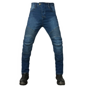 Detail of blue motorcycle denim pants with reinforced accordion stretch panels and stitching