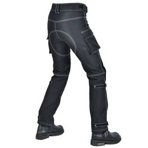 Detail of black motorcycle pants with white contrast stitching and adjustable buckle straps