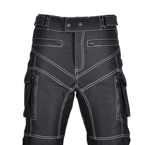 Detail of waterproof cargo pockets and white contrast stitching on black motorcycle pants