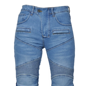 Close-up of light blue motorcycle jeans featuring accordion pleats and zipper pockets