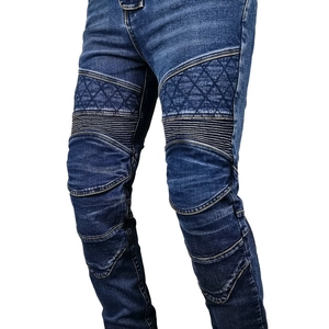 Men's blue motorcycle jeans featuring quilted thigh panels and accordion knee flex zones