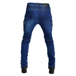 Detail view of denim motorcycle pants featuring flexible accordion stretch panels on the waist