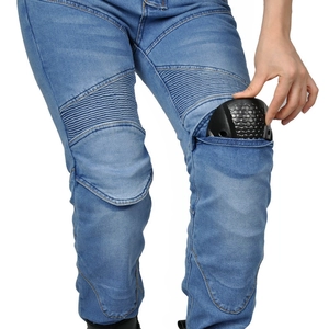 Detail of blue denim motorcycle jeans showing knee armor insertion and stretch panels