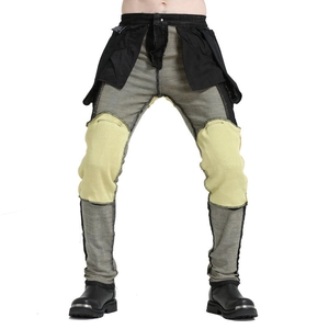 Detail view of motorcycle jeans interior showing yellow aramid reinforced protective lining