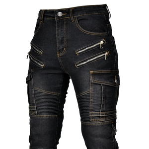Detail of motorcycle jeans featuring metal zippers and accordion pleated knees