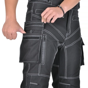 Detail showing tactical motorcycle pants with white stitching and waterproof pocket zipper